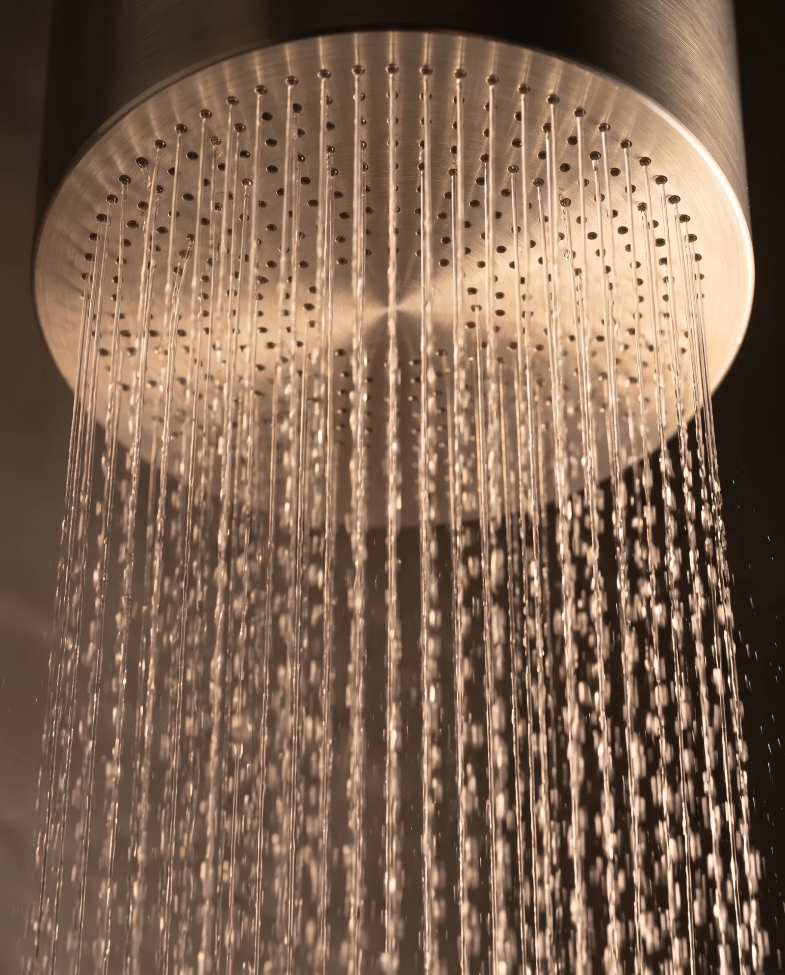 Rainfall water falling from the Monolith XL head, up close
