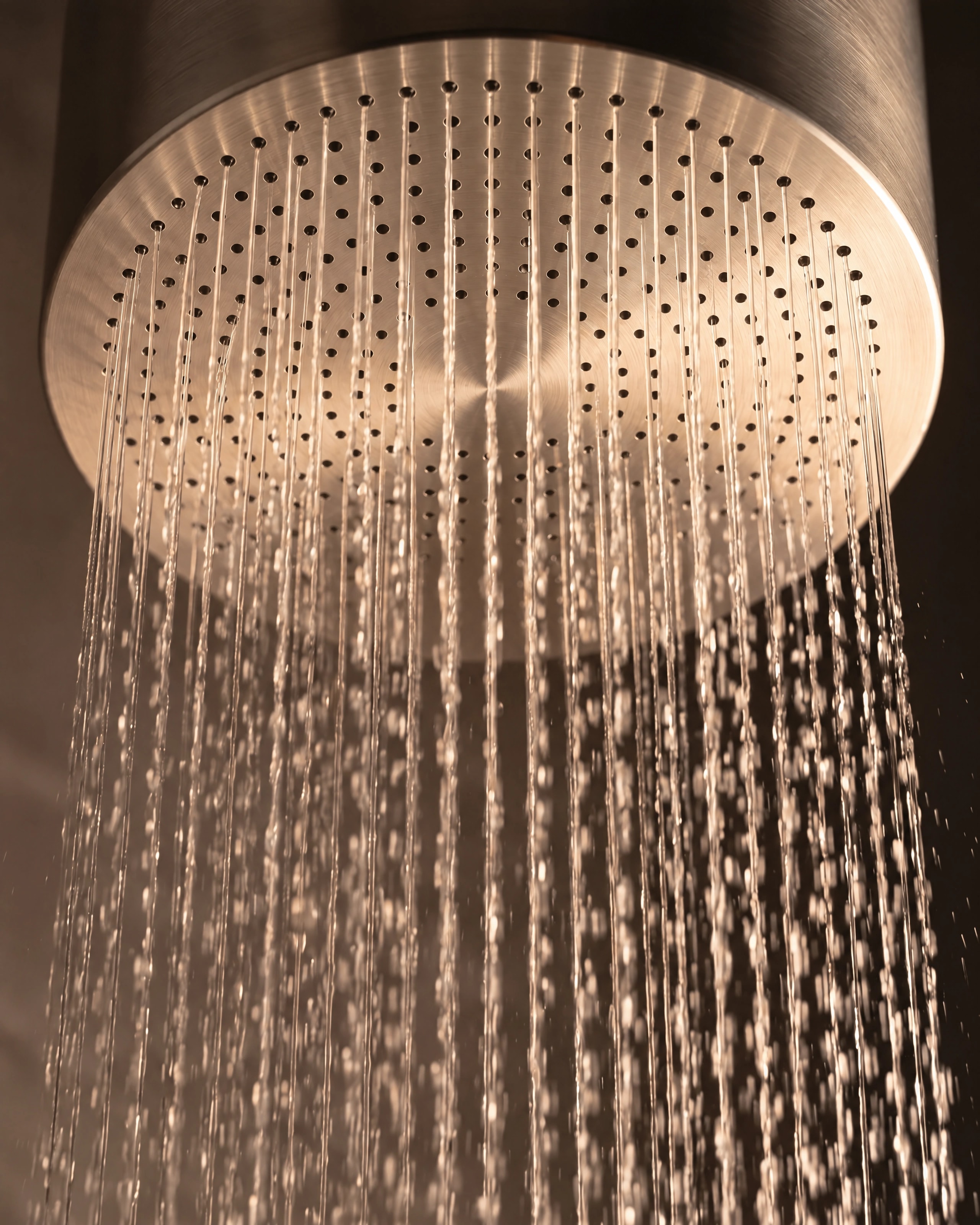 Close view of Monolith’s circular rainfall face and flowing water